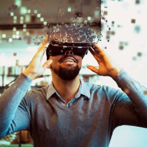 man looking through VR device