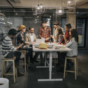 a group of people working at a desk