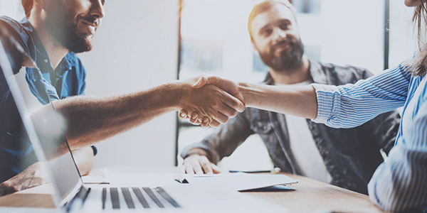 Business partners shaking hands